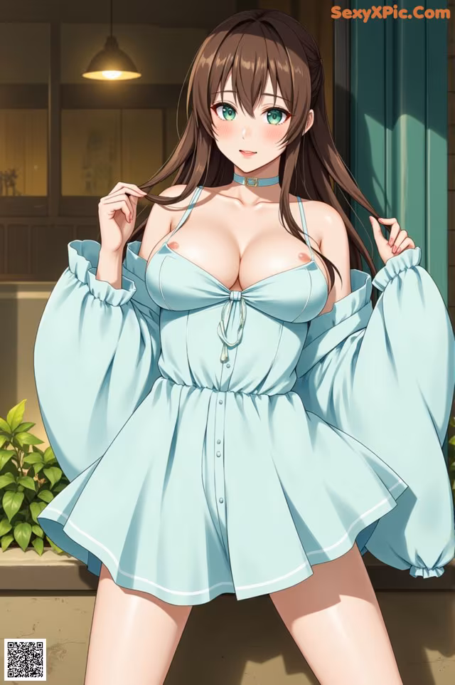 A woman in a blue dress posing for a picture.