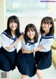 A group of young women in school uniforms posing for a magazine.