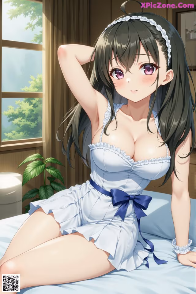 A woman in a white dress sitting on a bed.